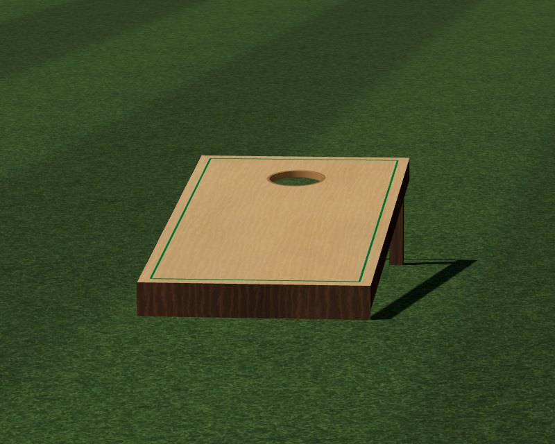 A slanted maple cornhole board on striped grass